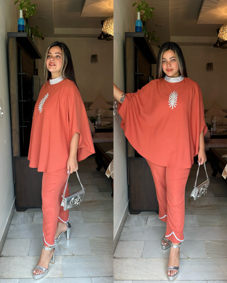 Orangish peach silver cape set
