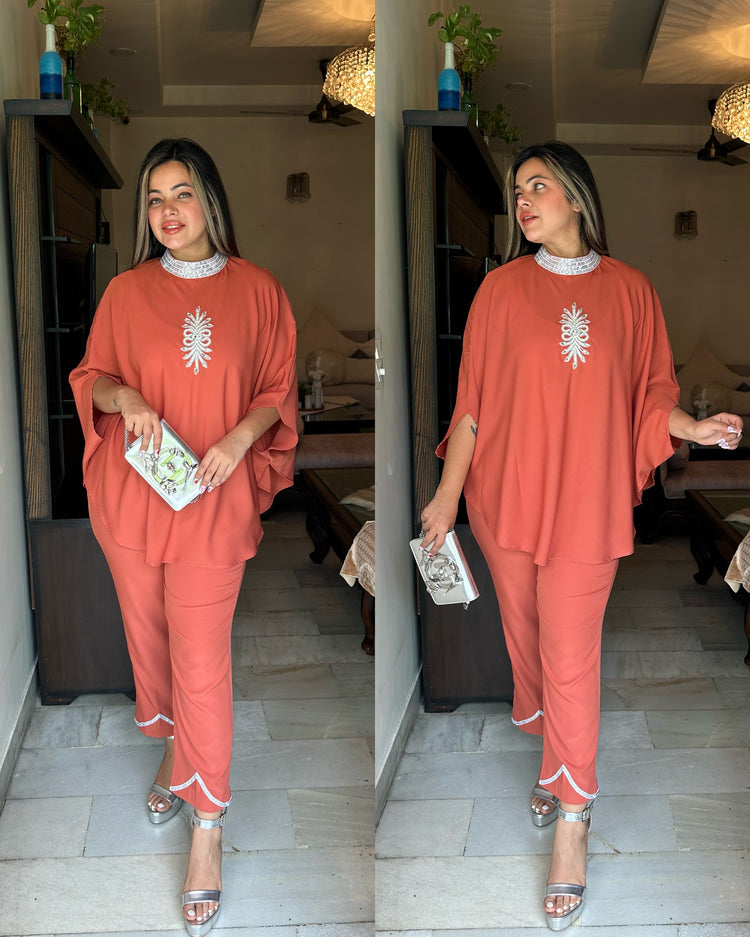 Orangish peach silver cape set