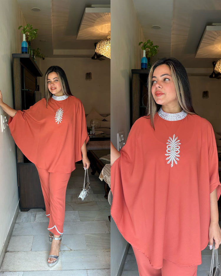 Orangish peach silver cape set